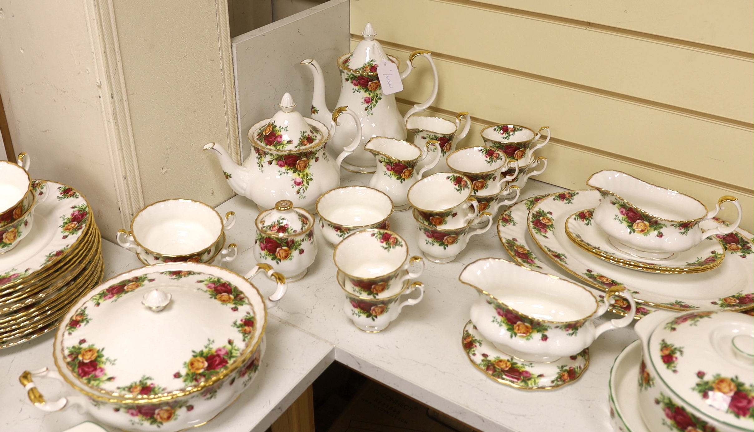 Royal Albert Old Country Roses, a large bone china service for twelve-place setting, and related accessories telephone, wall clock, table mats, napkins and cutlery.